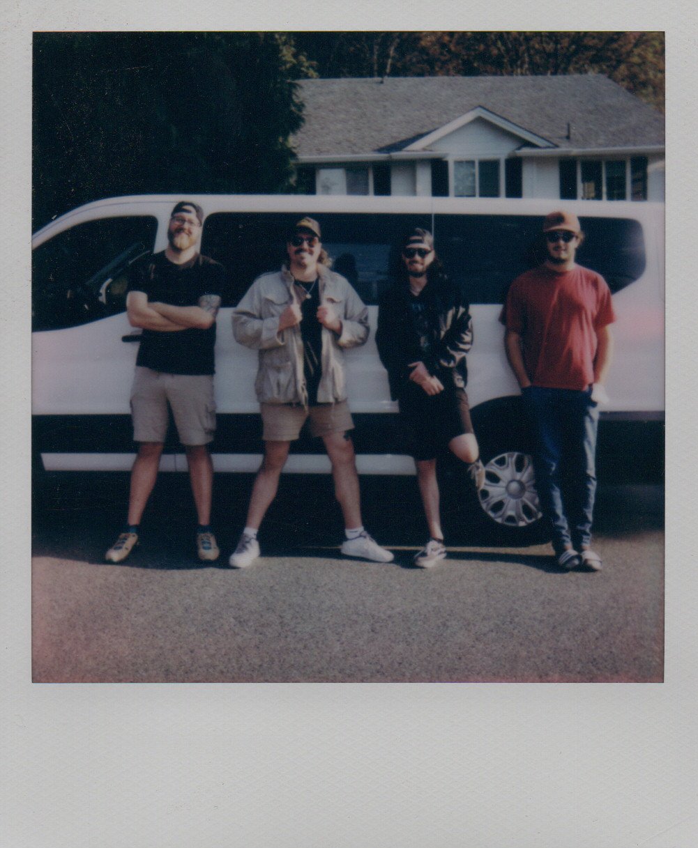 Trophy Dad posing in front of a Sprinter van.